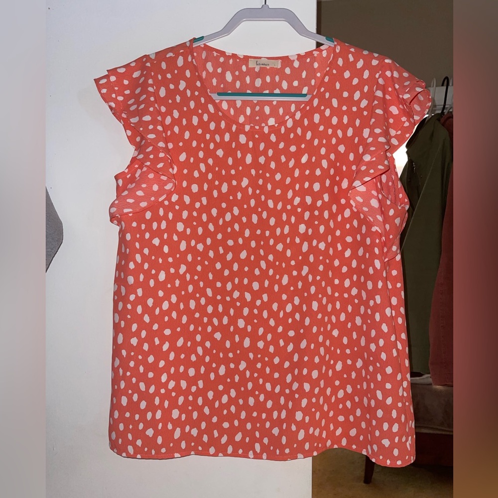 Coral colored thin blouse with white dot details